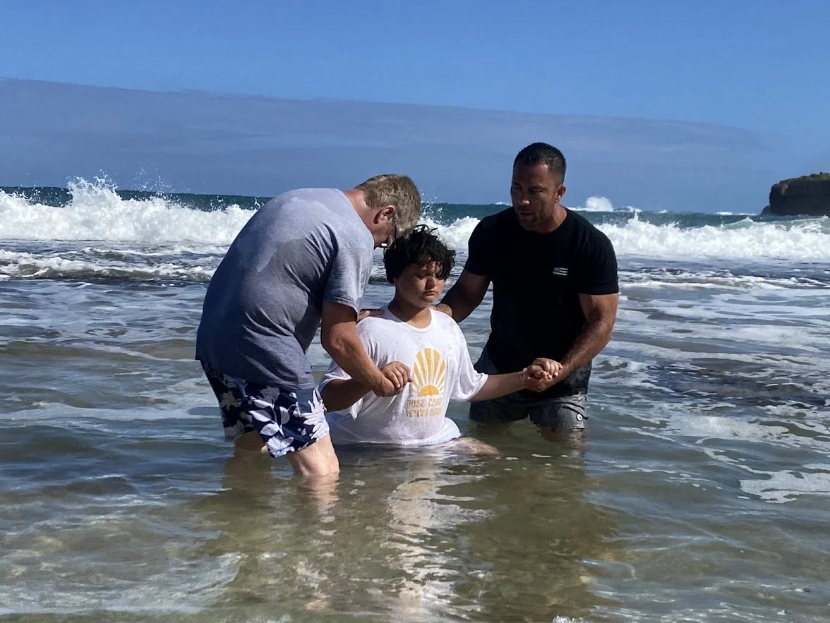 Campers and mentors sharing a meaningful moment in the ocean